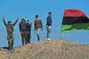 Rebel fighters at positions outside Brega, Libya, show their support for the opposition and their enthusiastic belief that they will overthrow the government in Tripoli, March 10, 2011