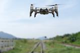 drone near train tracks
